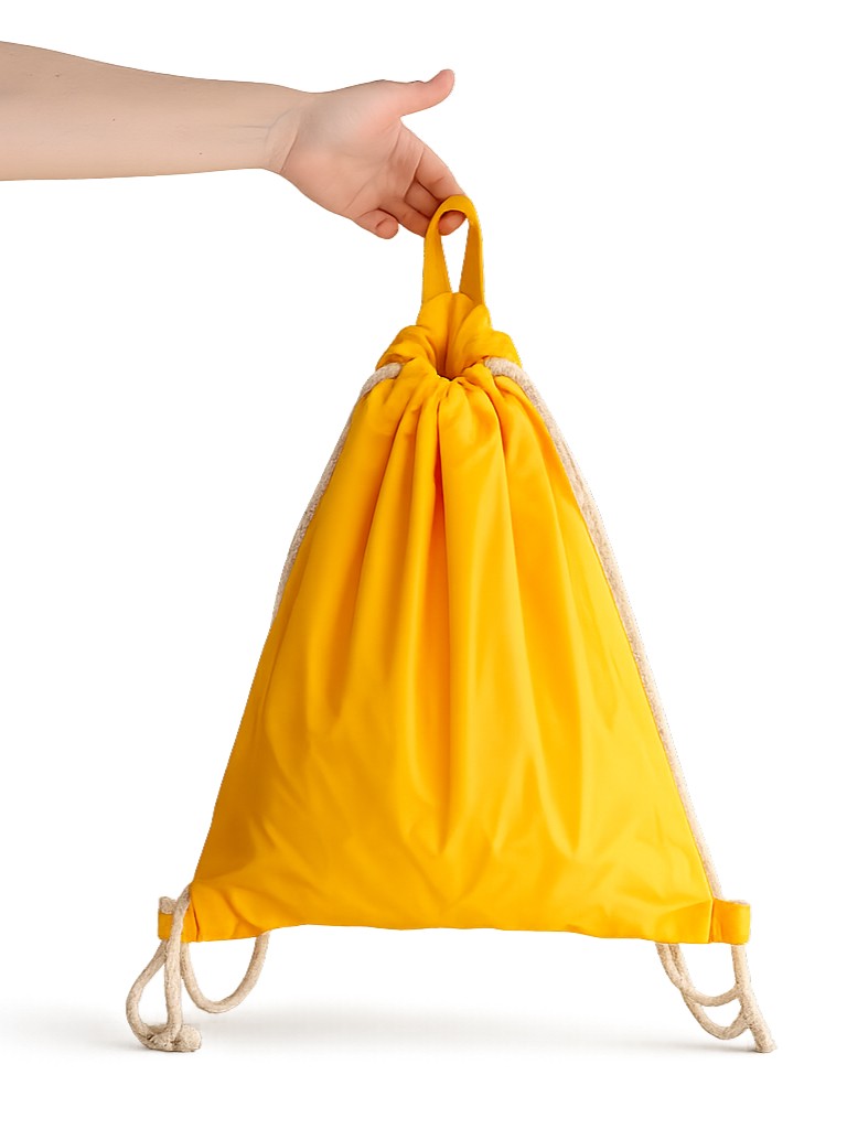 hand holding yellow backpack