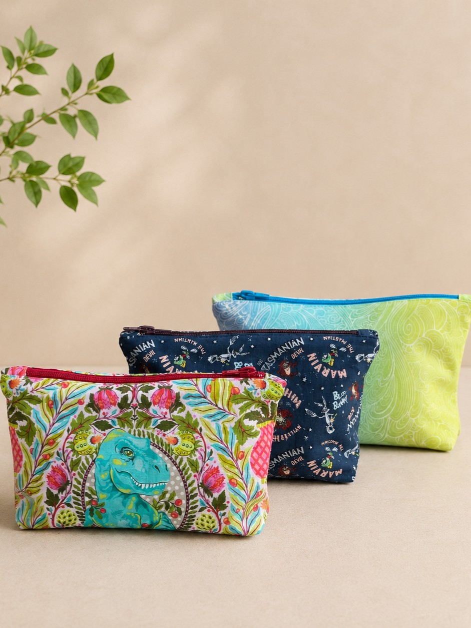 three hand made makeup bags on